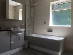Bathroom with shower over bath