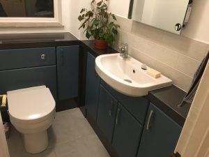 Teal coloured fitted furniture